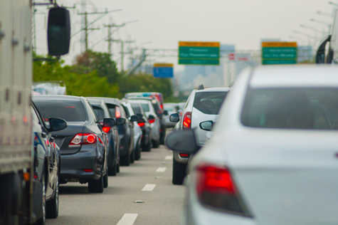 Cars on the road releasing CO2.